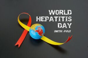 A red and yellow ribbin next to a globe with the words World Hepatitis Day 28th July.