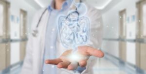 Conceptual Image of the Torso of a Doctor with their Hand Held Out and an Illustration of a Digestive Tract Floating Over It